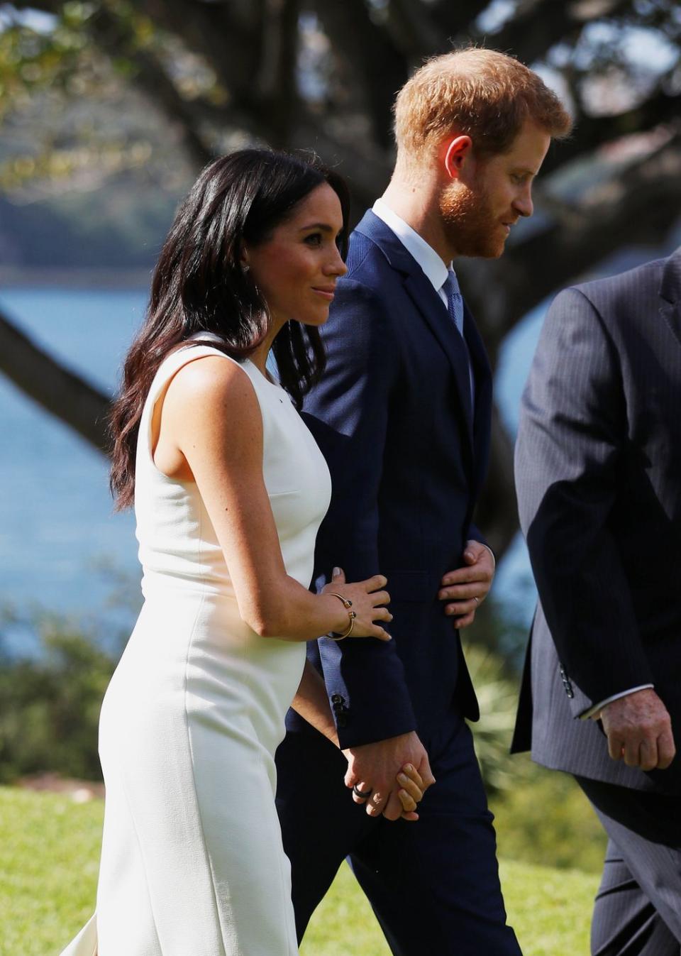 The Duke and Duchess of Sussex were visibly affectionate with one another on the first day of their royal tour