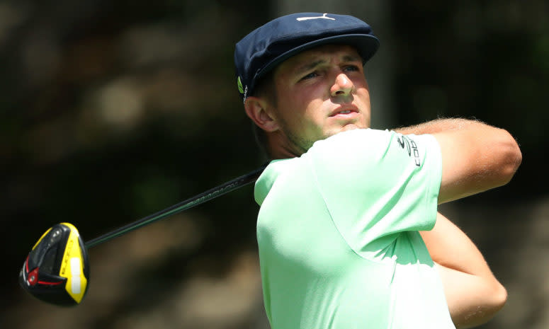 A closeup of Bryson DeChambeau in his follow through.