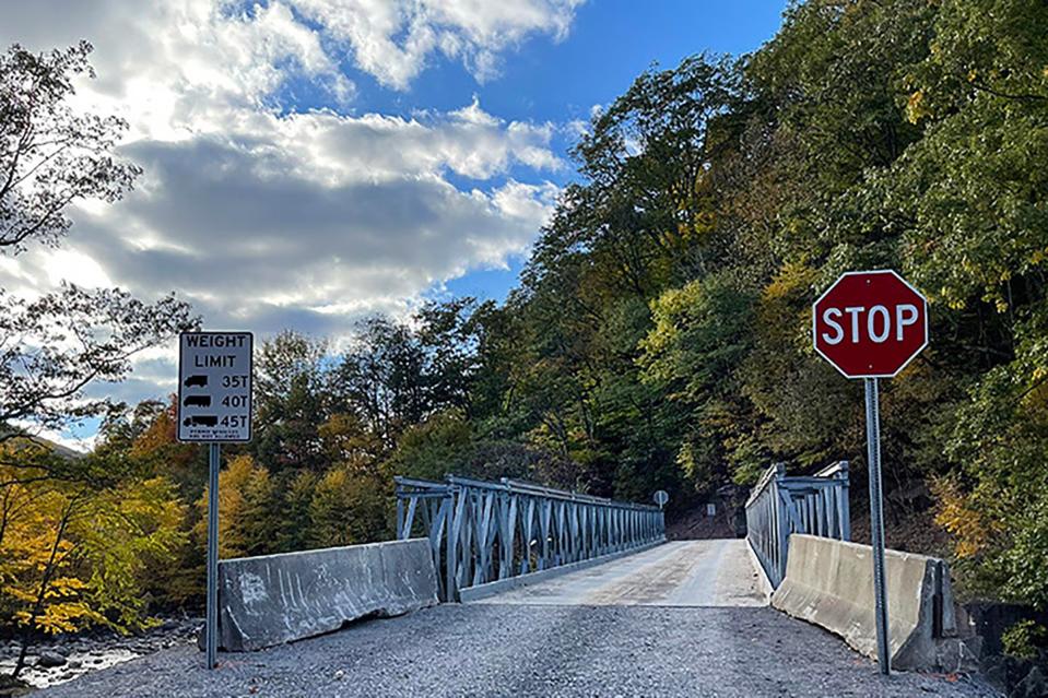 West Virginia Division of Highways (WVDOH) bridge crews will begin installation of a temporary bridge on WV 20 in Hinton on the morning of Saturday, Nov. 19, 2022, to span a massive sinkhole that opened under the road. Credit: West Virginia Division of Highways