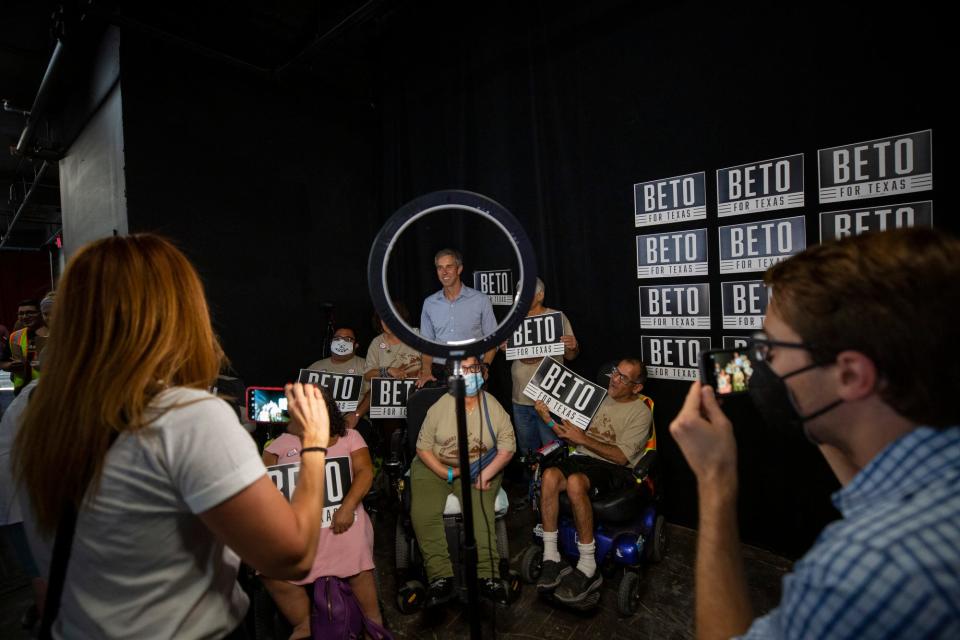 Beto O'Rourke takes photos with his supporters after his speech at the start of his "Drive for Texas" kickoff event at the Lowbrow Palace in El Paso on July 19, 2022.