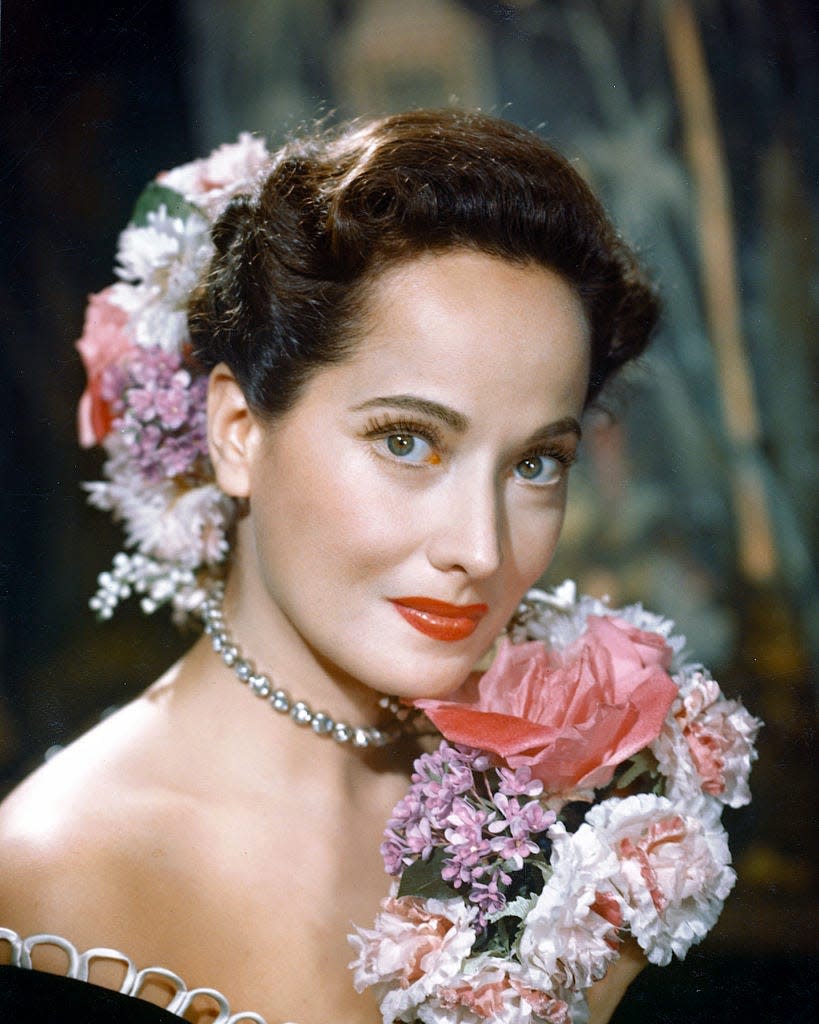 Merle Oberon posing