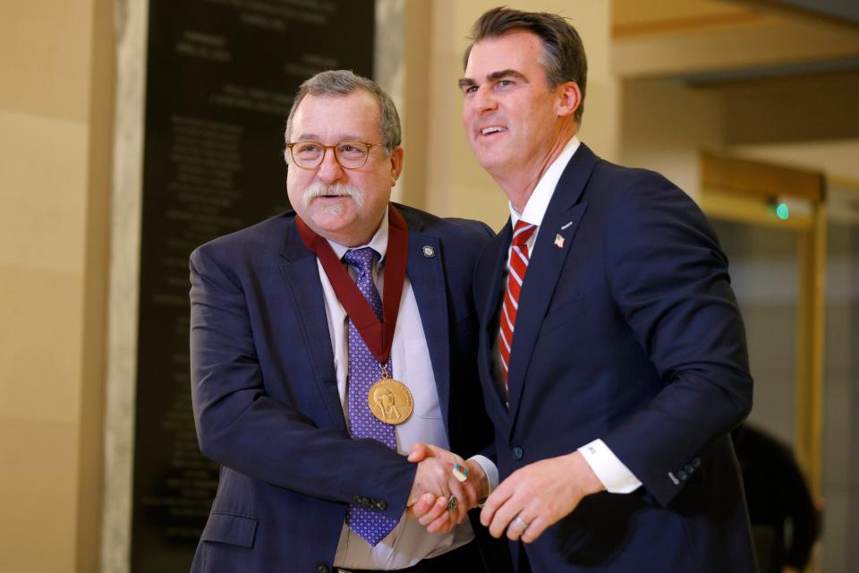 Rep. Mark McBride is given the George Nigh Public Service in the Arts Award by Gov. Kevin Stitt on Tuesday, Jan. 30, 2024, at the state Capitol in Oklahoma City.