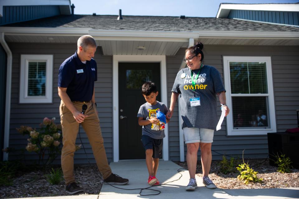 Brenda Martinez (right) talks about her excitement for her new home Wednesday, Aug. 16, 2023, in Holland Township.