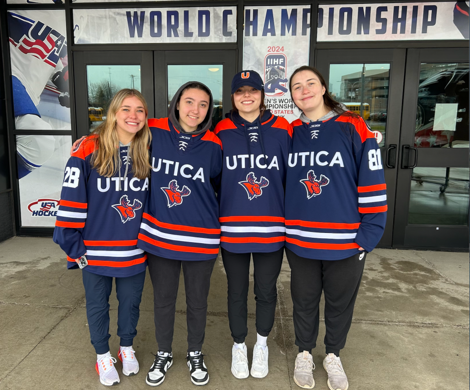 Carly Stefanini (MA), Cameron Evans (PA), Angelina Garganese (FL), and Sydney Mintz (CA) are freshmen this year on the Utica University women’s ice hockey team. They attended the opening IIHF championship game as a friend group.