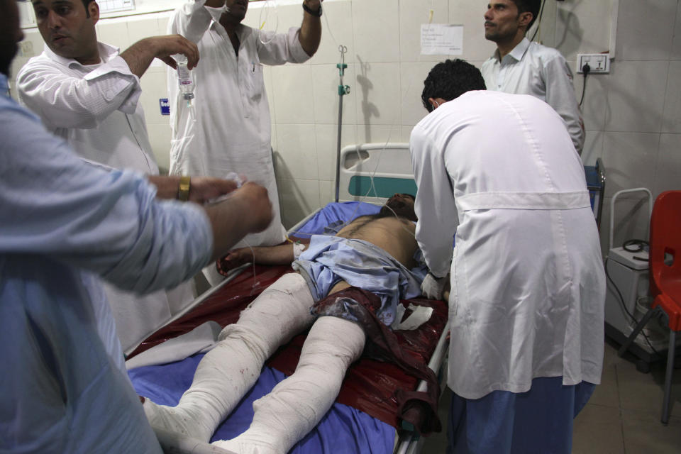 A wounded man receives treatment at a hospital after a suicide car bomb and multiple gunmen attack in the city of Jalalabad, east of Kabul, Afghanistan, Sunday, Aug. 2, 2020. A suicide car bomb and multiple gunmen attacked a prison in eastern Afghanistan on Sunday, Afghan officials said, killing at least one person and injuring dozens. (AP Photo)