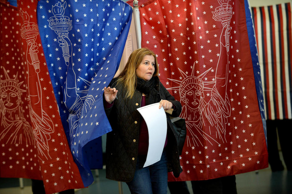 An early morning voter casts her vote at the Bishop Leo E. O'Neil Youth Center in Manchester, New Hampshire, on Nov. 8.