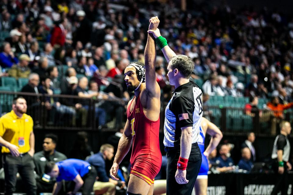 Iowa State's Marcus Coleman has his hand raised after scoring a major decision at 184 pounds during the first session of the NCAA Division I Wrestling Championships, Thursday, March 16, 2023, at BOK Center in Tulsa, Okla.