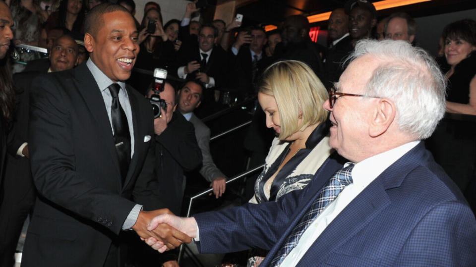 Jay-Z and Warren Buffett attend the grand re-opening of Jay-Z’s 40/40 Club on January 18, 2012 in New York City. (Photo by Theo Wargo/Getty Images for Berk Communications)