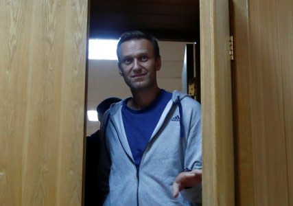 FILE PHOTO: Russian opposition leader Alexei Navalny, who was recently detained over his participation in an anti-government protest in January 2018, enters a hall inside a court building in Moscow, Russia August 27, 2018. REUTERS/Maxim Shemetov/File Photo