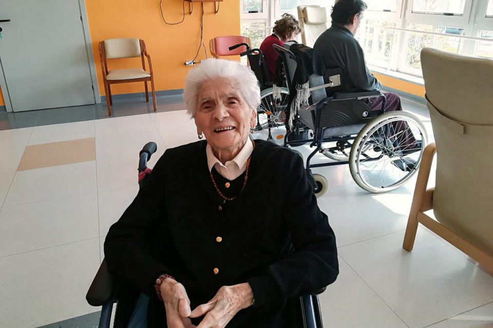 In this photo taken on April 6, 2020, 103-year-old Ada Zanussi, poses for pictures at the nursing home "Maria Grazia" in Lessona, northern Italy, after recovering from Covid-19 infection. To recover from coronavirus infection, as she did, Zanusso recommends courage and faith, the same qualities that have served her well in her nearly 104 years on Earth. The new coronavirus causes mild or moderate symptoms for most people, but for some, especially older adults and people with existing health problems, it can cause more severe illness or death. (Residenza Maria Grazia Lessona via AP Photo)