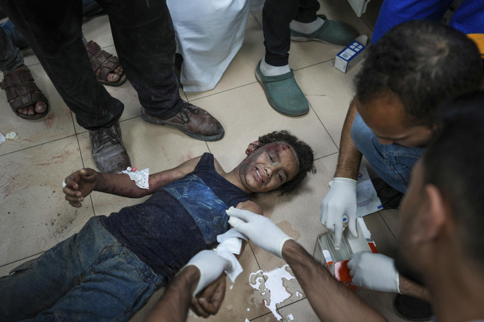 Palestinians wounded in the Israeli bombardment of the Gaza Strip are brought to Al Aqsa hospital in Deir al Balah, Gaza Strip, Tuesday, May 21, 2024. (AP Photo/Abdel Kareem Hana)