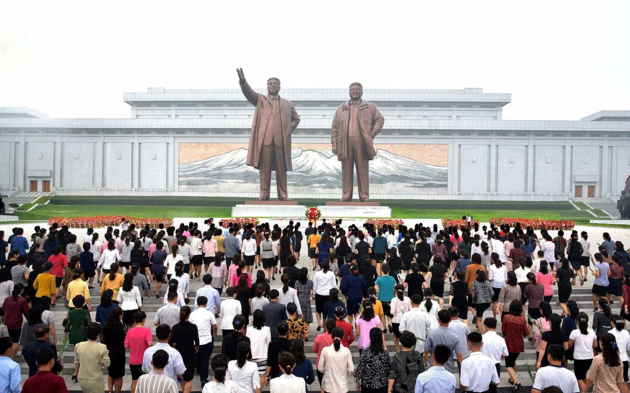 North Koreans paying tribute at the monuments of late leaders Kim Il-sung and Kim Jong-il in Pyongyang in September 2017 - YNA