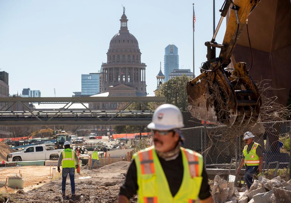 Construction workers work at the Texas Capitol Complex Project on Thursday January 13, 2022.