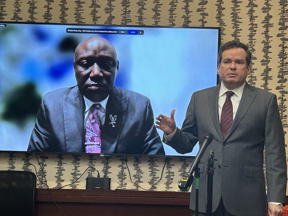 Mark Krudys, an attorney for the family of Central State Hospital homicide victim Irvo Noel Otieno, speaks during a news conference Monday, May 6, 2024, at his office in Richmond, Va. Behind him on the screen is Ben Crump, another family attorney who joined via livestream.