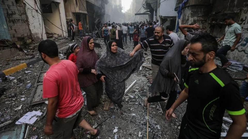 People at the site of an Israeli rocket attack in Al- Shati refugee camp in the west of Gaza City on October 14.  - Mohammed Saber/EPA-EFE/Shutterstock