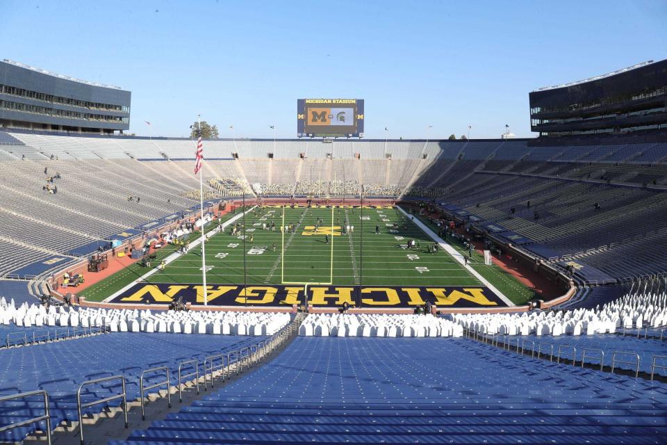 The Big House would normally be teeming with fans for one of the biggest rivalries in Big Ten football, but instead an empty Michigan Stadium dotted with cardboard cutouts greets players before the Michigan State/Michigan game in Ann Arbor on October 31, 2020.