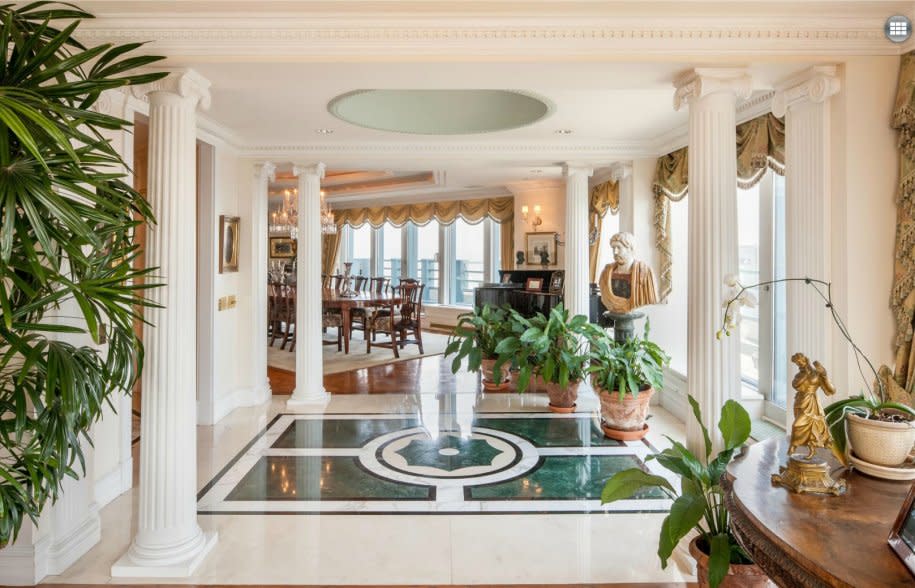 The entryway is reminiscent of Versailles.