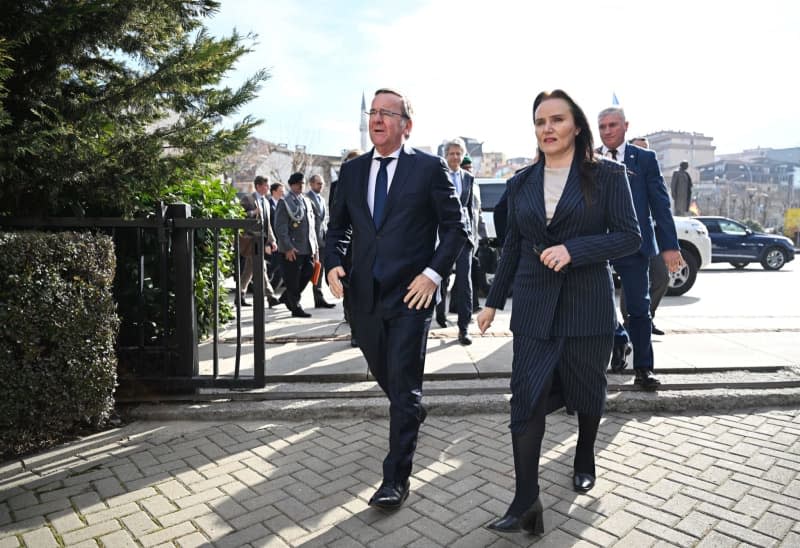 Boris Pistorius (C), Germany's Defence Minister, arrives at the official residence of Kosovan President Osmani during his visit. Soeren Stache/dpa