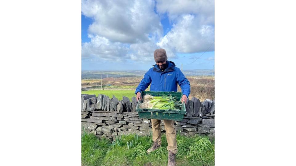 JB gill holding crate of leeks 