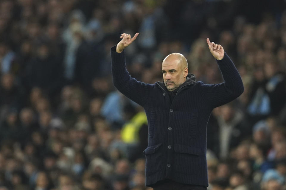 Manchester City's head coach Pep Guardiola reacts during the English Premier League soccer match between Manchester City and Aston Villa at the Etihad Stadium in Manchester, England, Sunday, Feb. 12, 2023. (AP Photo/Dave Thompson)