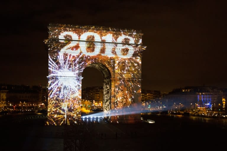 Art work is projected on Arc de Triomphe for New Year's celebrations on the Champs-Elysees avenue in Paris on January 1, 2016