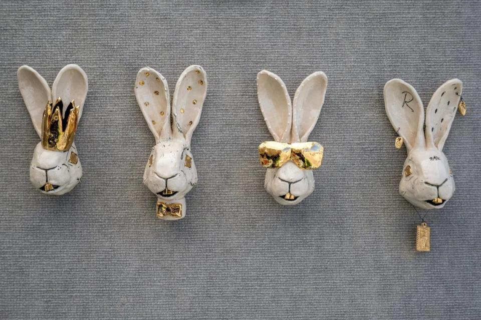 Ceramic rabbits, known as “Bling buns” and crafted by artist Reiko Uchytil of Grimes, Iowa, are displayed at her booth while preparing for the Brookside Art Annual on Friday in Kansas City.