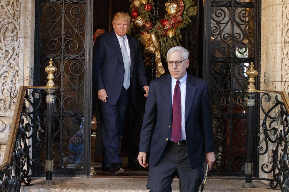 President-elect Donald Trump walks out with Carlyle Group co-founder and co-CEO David Rubenstein after meeting at Mar-a-Lago, Wednesday, Dec. 28, 2016, in Palm Beach, Fla. (AP Photo/Evan Vucci)