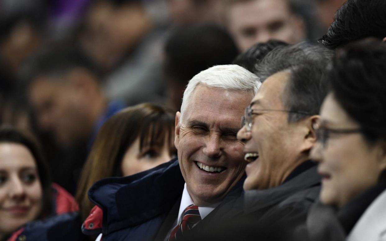 US Vice President Mike Pence (C) talks to South Korea's President Moon Jae-in during the short track speed skating event during the Pyeongchang 2018 Winter Olympic Games - AFP