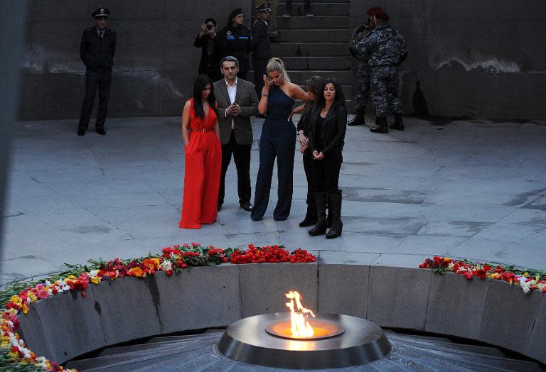 US reality TV star Kim Kardashian (L) and her sister Khloe (3rdL) visit the genocide memorial, which commemorates the 1915 mass killing of Armenians in the Ottoman Empire, in Yerevan on April 10, 2015