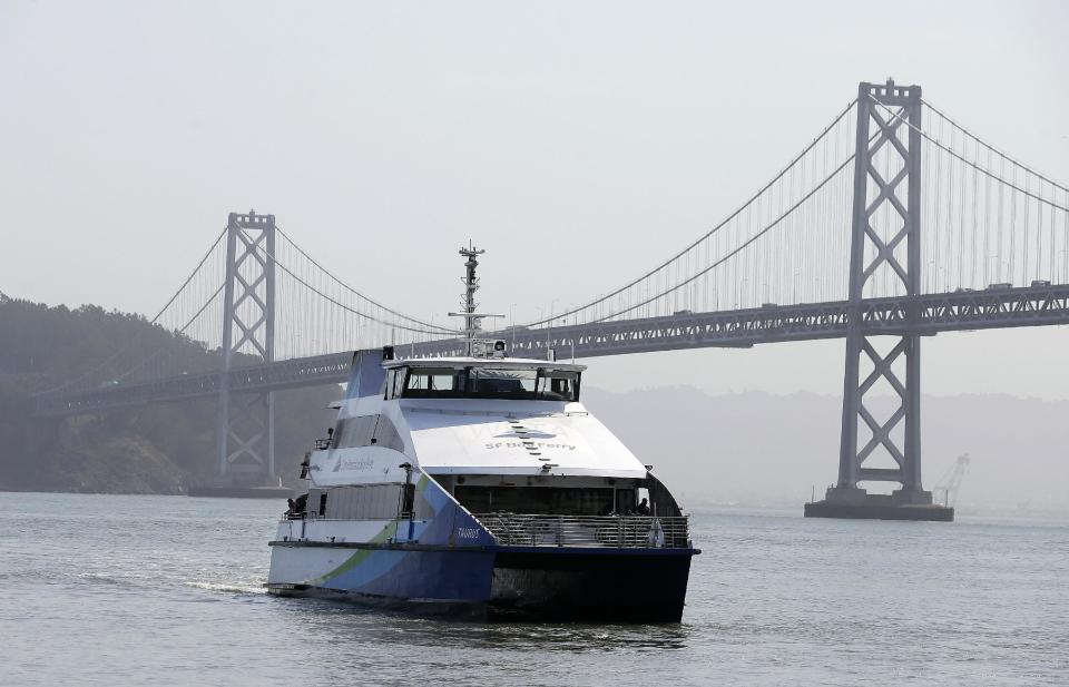 A San Francisco Bay Ferry arrives from Alameda at the Ferry Terminal in San Francisco, Tuesday, July 2, 2013. San Francisco Bay area commuters endured another tough morning commute on Tuesday, as a strike by workers for a heavily used train system entered its second day. Lines for ferries and buses appeared even longer than on Monday, and BART said charter buses it was running at four stations reached capacity before 7 a.m. and could not accommodate additional passengers. (AP Photo/Jeff Chiu)