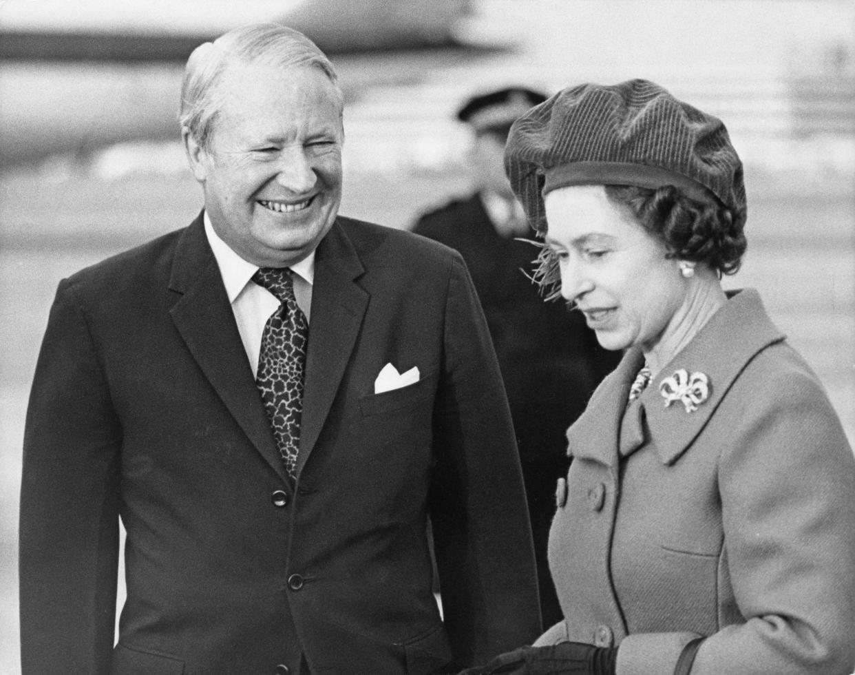 Queen Elizabeth II with Sir Edward Heath at Heathrow Airport in January 1974