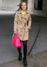 Celebrities in neon fashion: Laura Whitmore worked her beige trench coat with a bright pink bag.<br><br>[Rex]