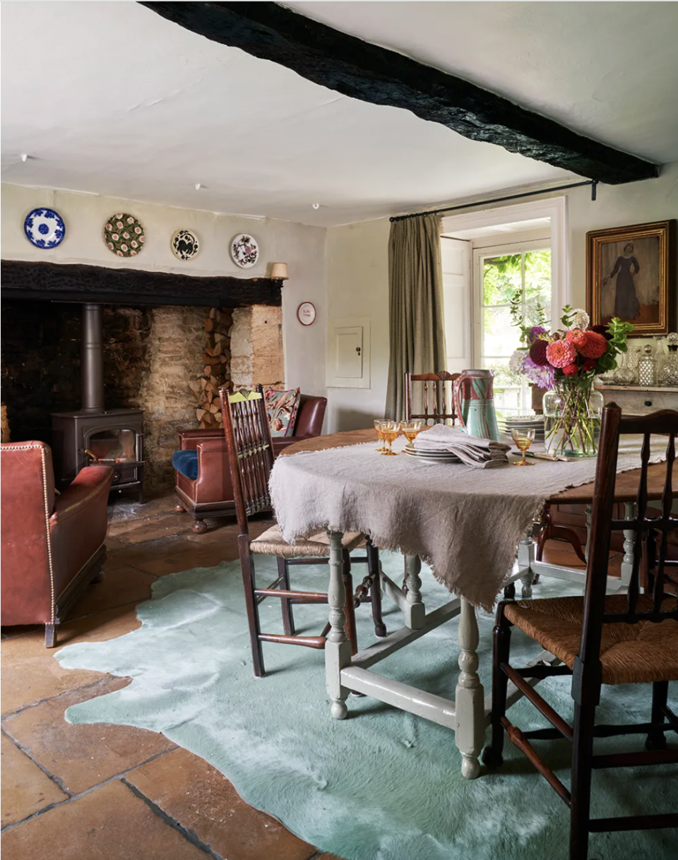 a dining room with a table and chairs