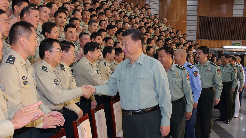 Chinese leader Xi Jinping shakes hands with officers during his inspection of the PLA's Rocket Force in Beijing on September 26, 2016. - Li Gang/XinhuaGetty Images