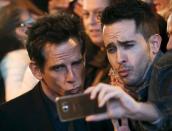 Cast member U.S. actor Ben Stiller (L) poses with a fan during a photo call before the fans screening of his latest film "Zoolander 2" in central Madrid, Spain, February 1, 2016. REUTERS/Sergio Perez