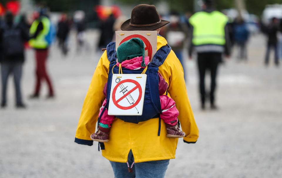 A protester at rally in Stuttgart, Germany, wears a sign signaling opposition to a coronavirus vaccine, May 2, 2020. (Photo: picture alliance via Getty Images)