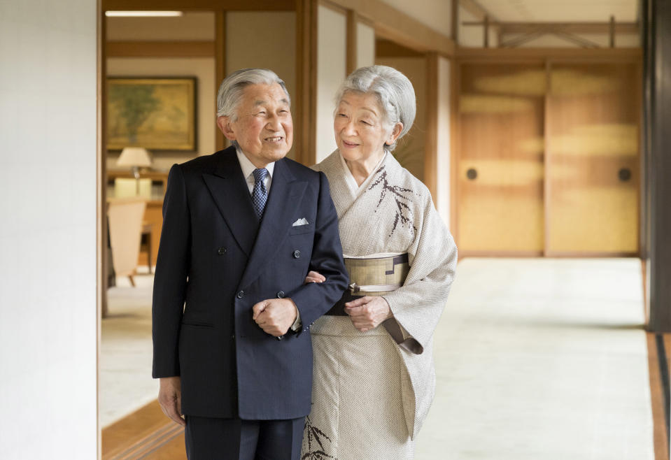 In this Dec. 10, 2018 photo released Sunday, Dec. 23, 2018, by the Imperial Household Agency of Japan, Japan's Emperor Akihito, left, and Empress Michiko, right, pose for a photograph at the Imperial Palace in Tokyo. Emperor Akihito, who turns 85 on Sunday, Dec. 23, and will abdicate this spring, says he feels relieved to see the era of his reign coming to an end without having seen his country at war. (The Imperial Household Agency of Japan via AP)