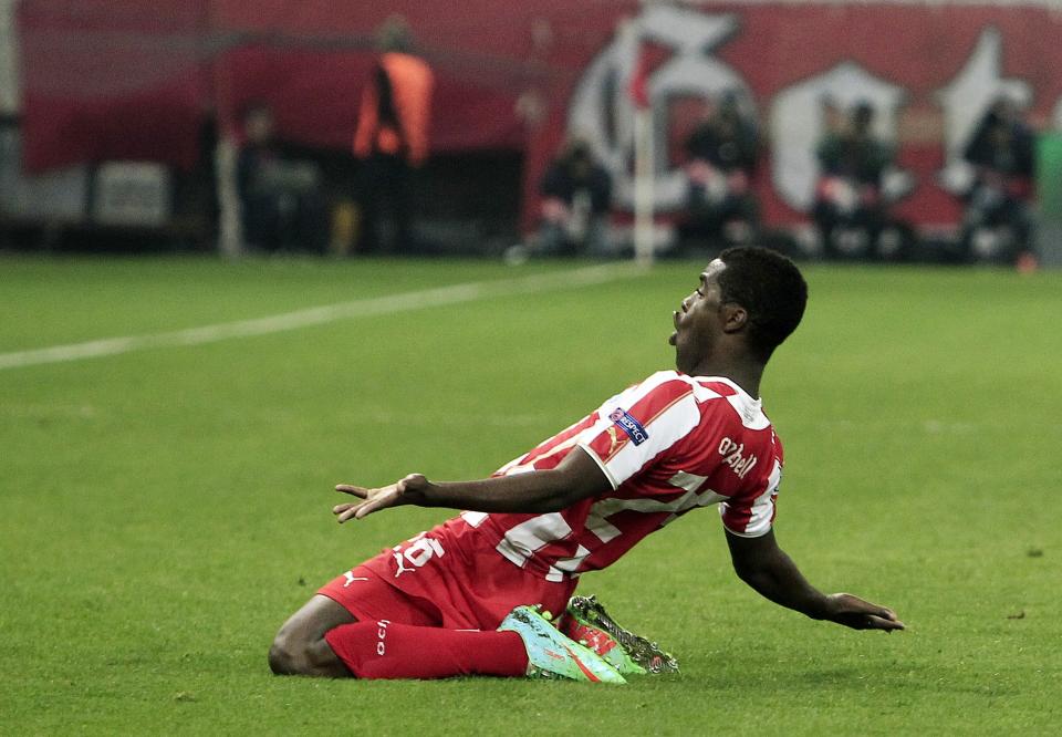 Olympiakos' Joel Campbell celebrates after scoring the second goal of his team against Manchester United during their Champions League, round of 16, first leg soccer match at Georgios Karaiskakis stadium, in Piraeus port, near Athens, on Tuesday, Feb. 25, 2014. (AP Photo/Thanassis Stavrakis)