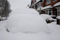 A car covered with snow in Birmingham (SWNS)