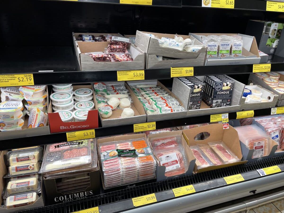 European deli meats on the lower refrigerated shelf at Aldi, Reynoldsburg, Ohio, cheeses on the two higher shelves