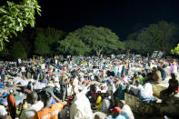 <p>Displaced people gather on Place Boyer in Petion-Ville to spend the night, following a major earthquake on Jan.13, 2010 in Port-au-Prince, Haiti. A 7.0 earthquake rocked Haiti today, followed by at least a dozen aftershocks, causing widespread devastation in the capital of Port-au-Prince. (Photo: Frederic Dupoux/Getty Images) </p>