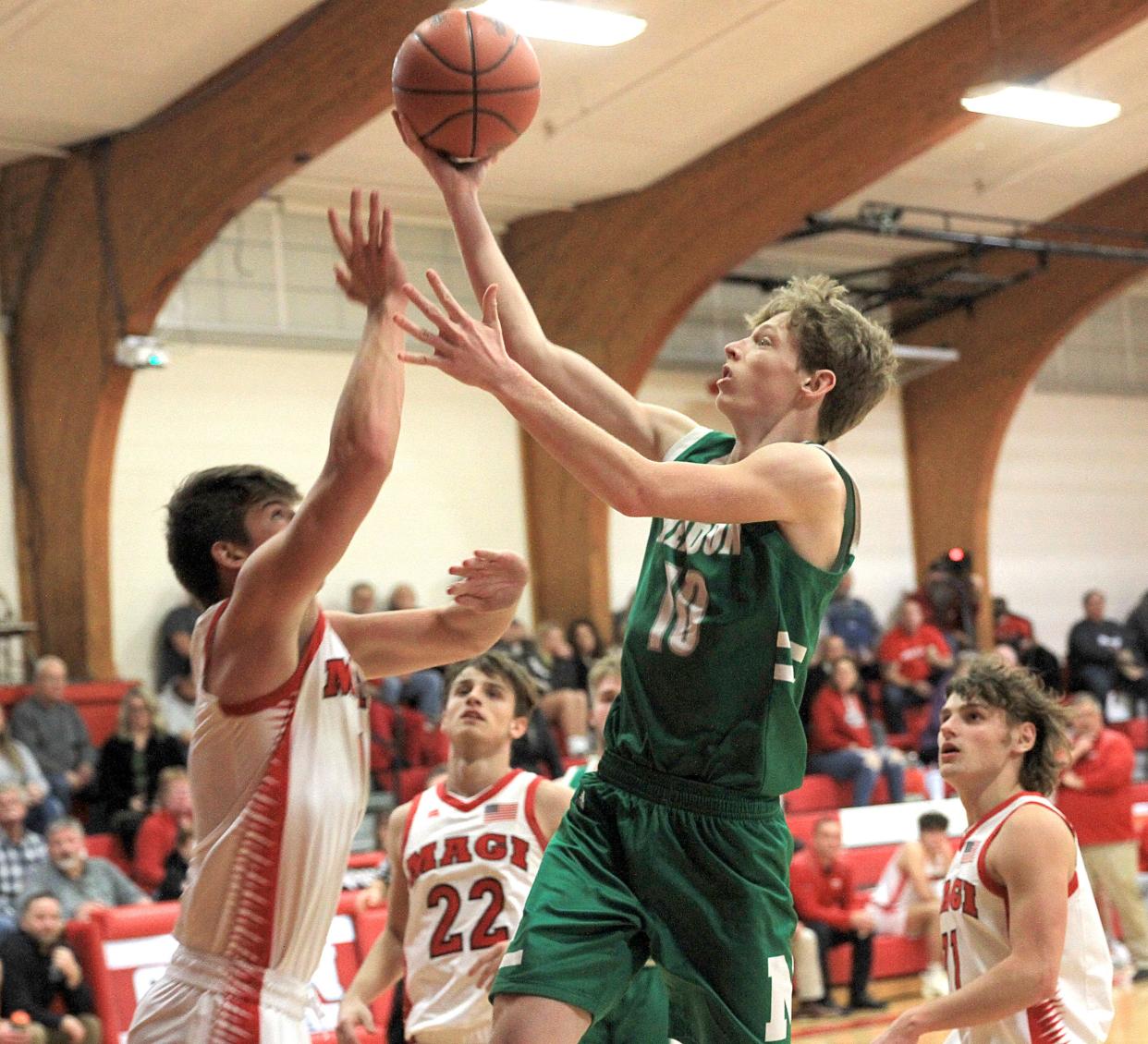 Luke Schinker scores two of his team-high 13 points for Mendon against Colon on Tuesday.