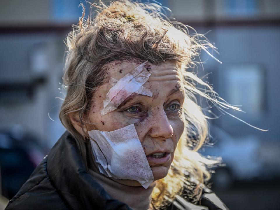 Helena, a 53-year-old teacher, stands outside a hospital after the bombing of the eastern Ukraine town of Chuguiv on 24 February (AFP/Getty)