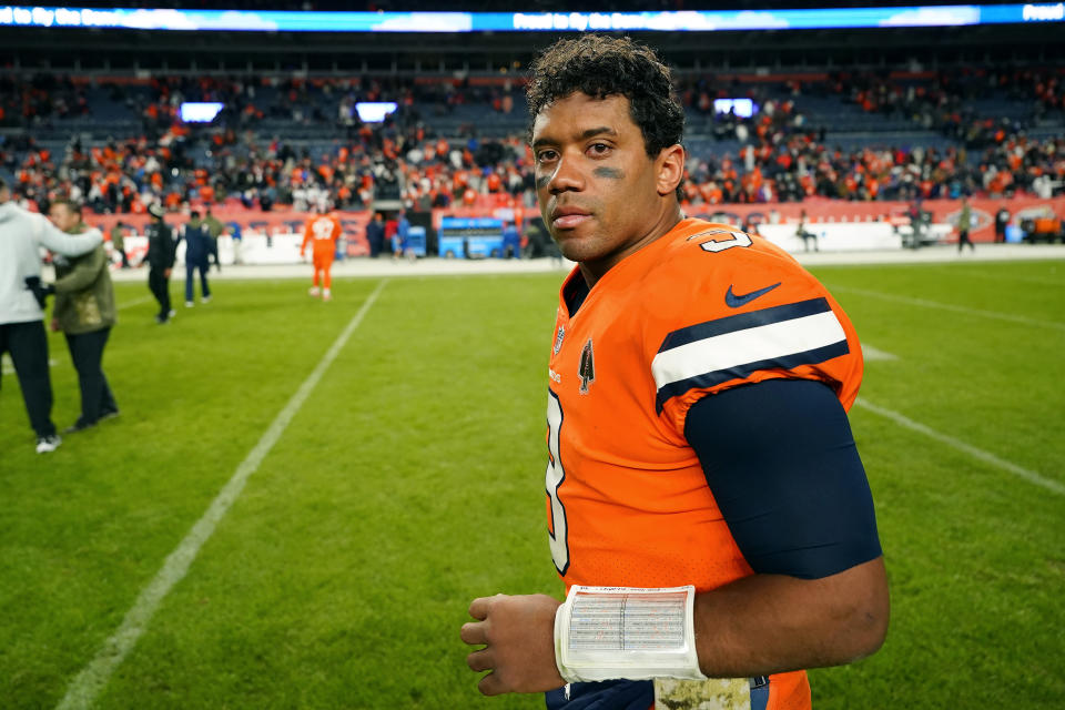 Denver Broncos quarterback Russell Wilson walks off the field after an NFL football game against the Las Vegas Raiders in Denver, Sunday, Nov. 20, 2022. The Raiders won 22-16 in overtime. (AP Photo/Jack Dempsey)