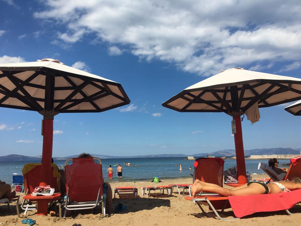 chairs and umbrellas on karavi beach in greece