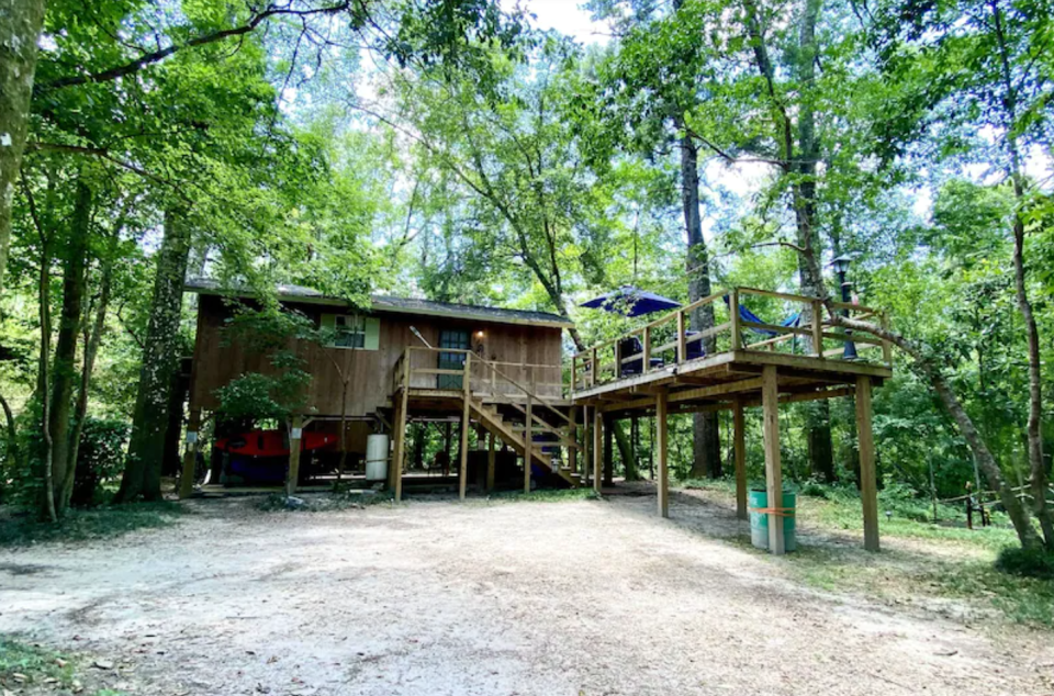 Enjoy the view, explore the acreage and play in a creek at this cabin in Poplarville.