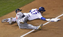 Minnesota Twins third baseman Josh Donaldson (24) tags out Chicago Cubs' Kris Bryant (17) at third base during the first inning of a baseball game, Friday, Sept. 18, 2020, in Chicago. (AP Photo/David Banks)