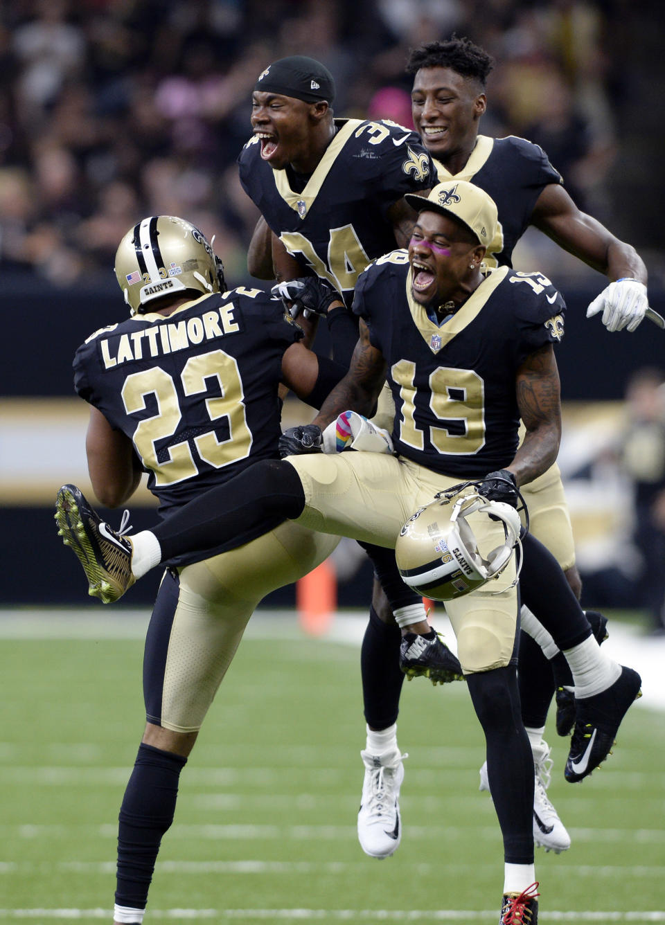 <p>New Orleans Saints cornerback Marshon Lattimore (23) celebrates his interception and touchdown with wide receiver Ted Ginn (19) and defensive back Justin Hardee (34) in the second half of an NFL football game against the Detroit Lions in New Orleans, Sunday, Oct. 15, 2017. (AP Photo/Bill Feig) </p>