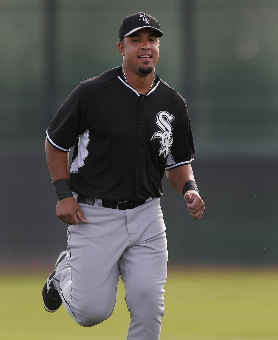 Chicago White Sox's Jose Abreu runs during spring training baseball practice in Glendale, Ariz., Wednesday, Feb. 19, 2014. (AP Photo/Paul Sancya)