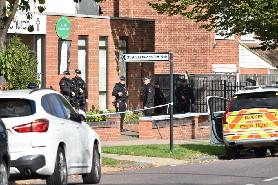 Armed police officers outside the Belfairs Methodist Church (PA)